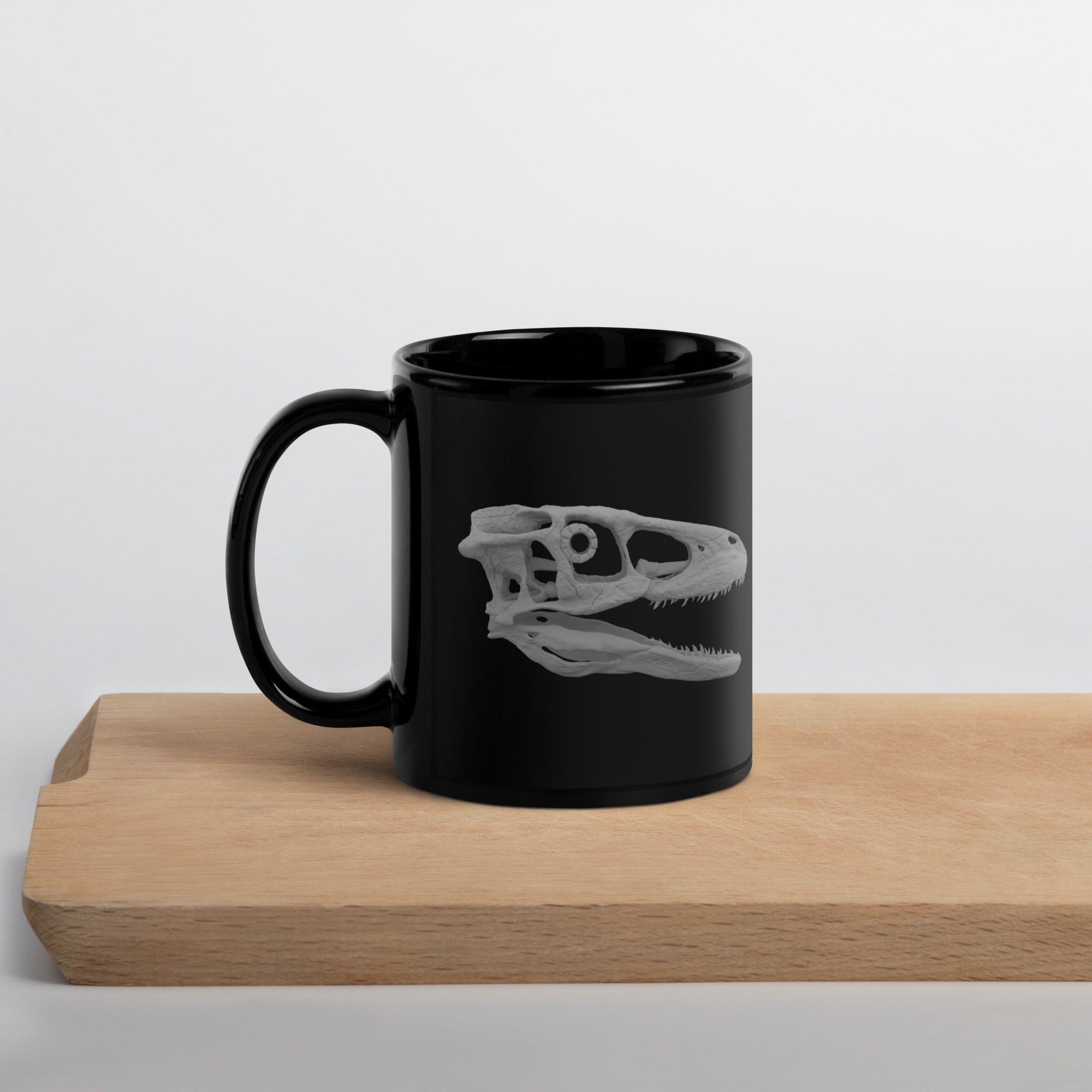 Taza negra brillante cráneo Deinonychus